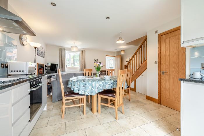Buttercup Cottage rests in Redlynch, Wiltshire. Three-bedroom home resting rurally. Family-friendly.