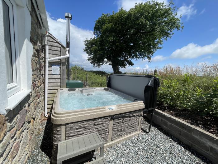 Dairy Cottage in Tavernspite near Whitland, Pembrokeshire, hot tub, dog-friendly, off-road parking.