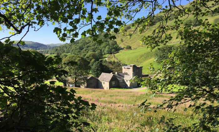 Kentmere Hall Bank Barn is in Kentmere, Cumbria. Three-bedroom home in national park. Pet-friendly.