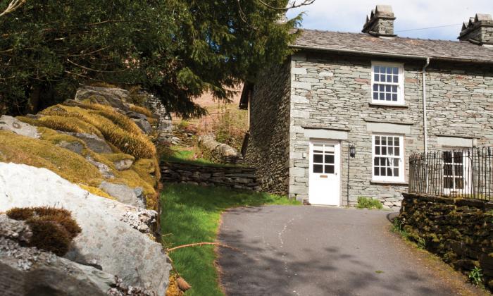Beck Steps rests in Chapel Stile, in Cumbria. Two-bedroom cottage near amenities. Woodburning stove.