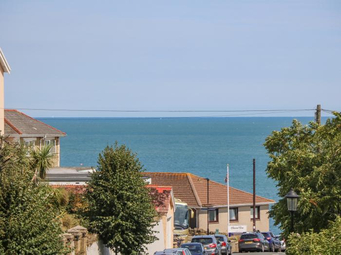 7 Hope Road rests in Shanklin, upon Isle of Wight. Three-bedroom home with sea glimpses. Near beach.