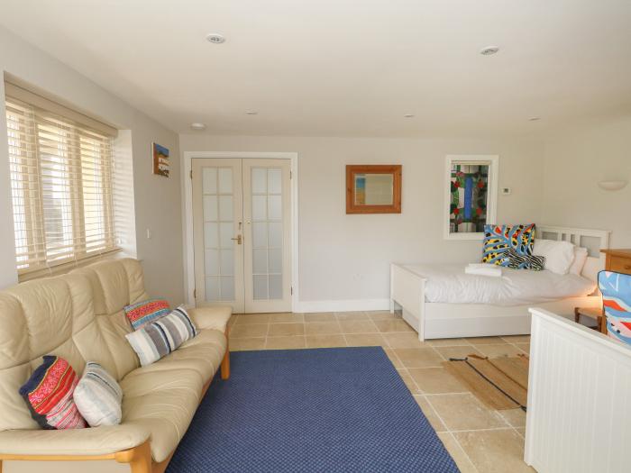 Sandy Combe, West Bay, Dorset. Four-bedroom, reverse-level home with sea views. In AONB. Near beach.