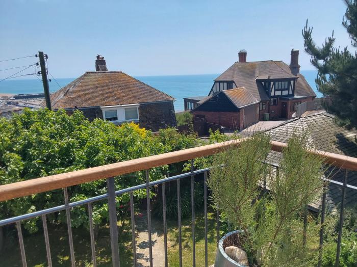 Sandy Combe, West Bay, Dorset. Four-bedroom, reverse-level home with sea views. In AONB. Near beach.