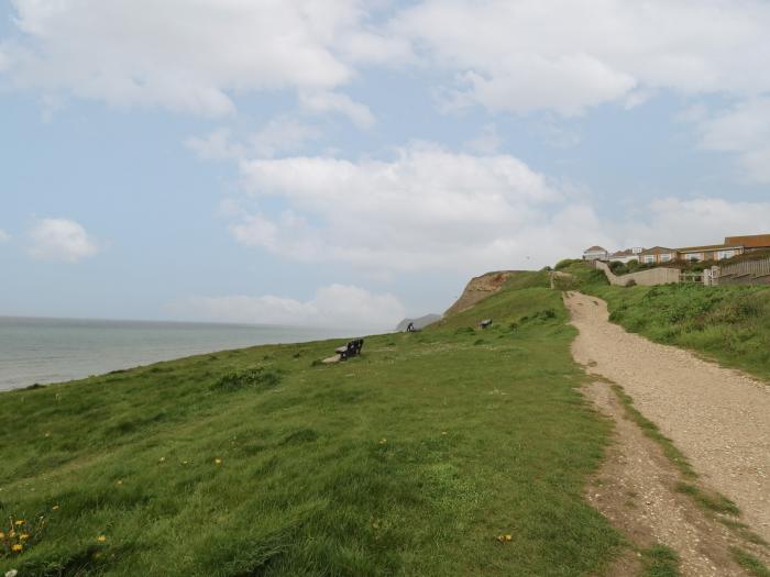 Sandy Combe, West Bay, Dorset. Four-bedroom, reverse-level home with sea views. In AONB. Near beach.