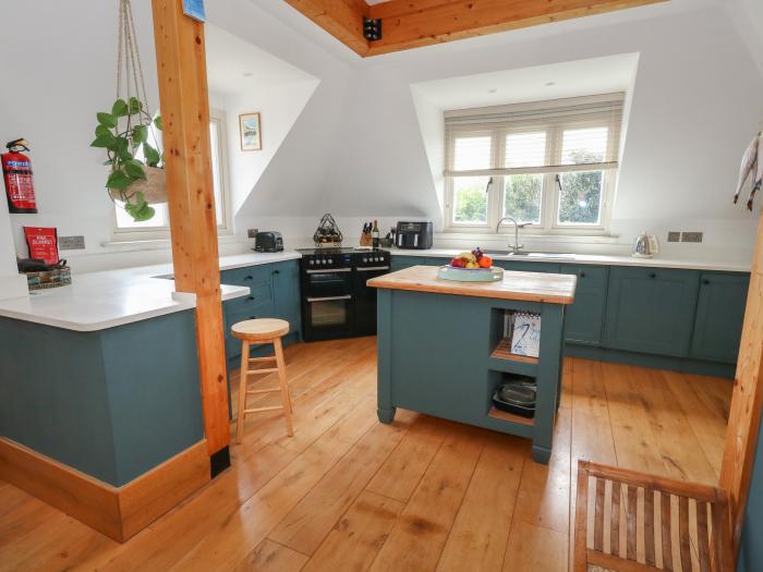 Sandy Combe, West Bay, Dorset. Four-bedroom, reverse-level home with sea views. In AONB. Near beach.