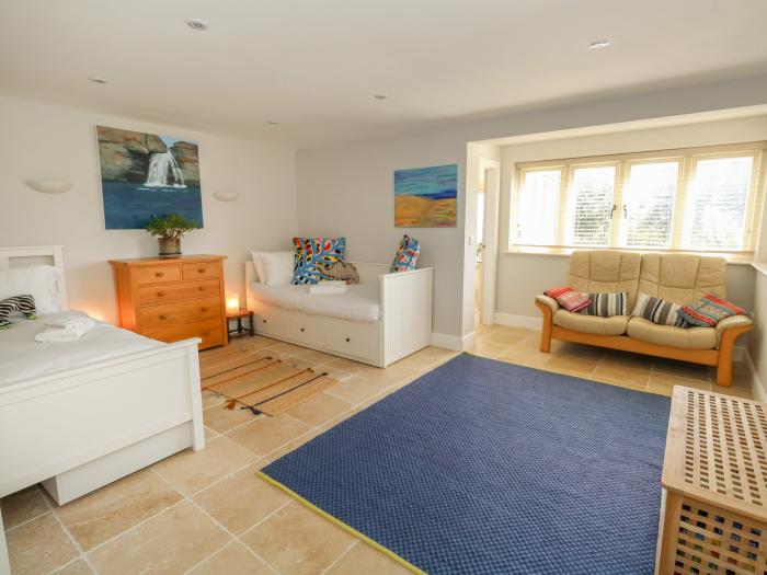 Sandy Combe, West Bay, Dorset. Four-bedroom, reverse-level home with sea views. In AONB. Near beach.