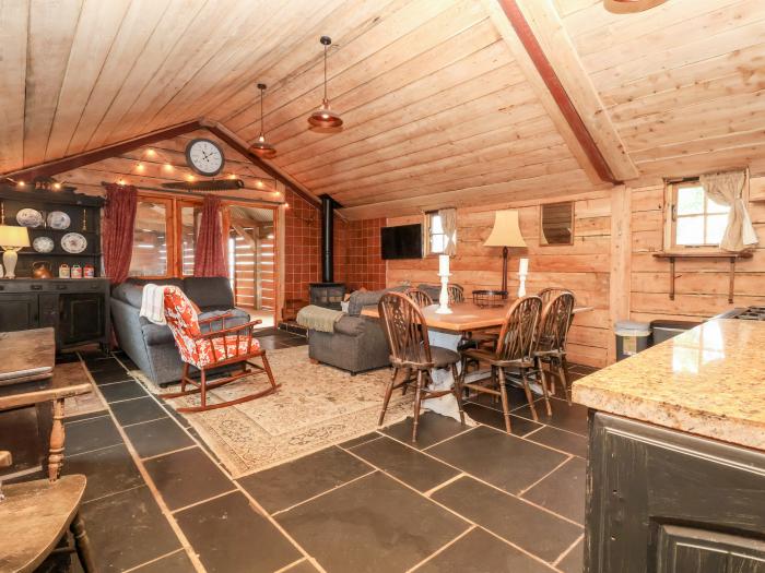 Y Caban in Llangollen, Wrexham. Three double bedrooms. Rustic. Open-plan living space. Pet-friendly.