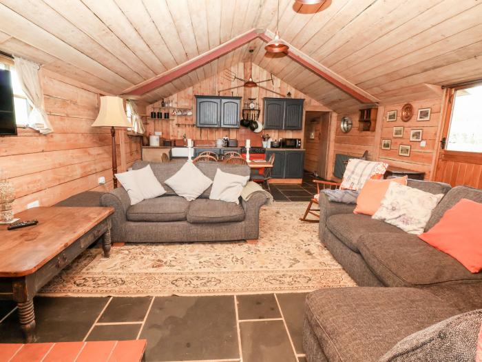 Y Caban in Llangollen, Wrexham. Three double bedrooms. Rustic. Open-plan living space. Pet-friendly.