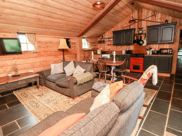 Y Caban in Llangollen, Wrexham. Three double bedrooms. Rustic. Open-plan living space. Pet-friendly.