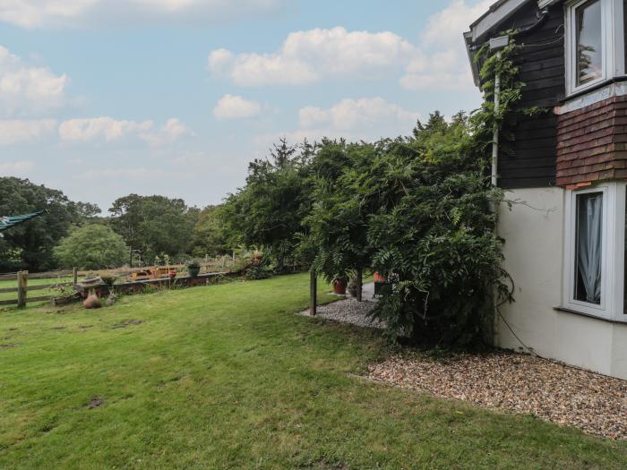 Brook Farm, rests near Ringwood, Hampshire. Four-bedroom home set rurally. Woodburning stove. Large.