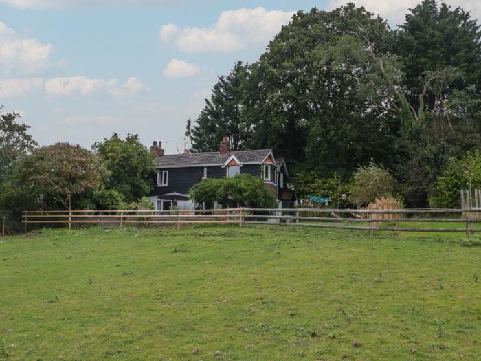 Brook Farm, rests near Ringwood, Hampshire. Four-bedroom home set rurally. Woodburning stove. Large.