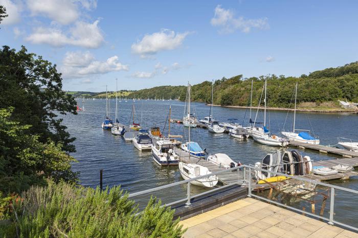 Cliff Cottage rests in Galmpton, Devon. Five-bedroom home with stunning views over River Dart. Large