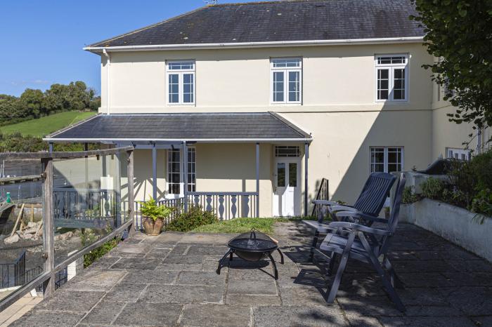 Cliff Cottage rests in Galmpton, Devon. Five-bedroom home with stunning views over River Dart. Large