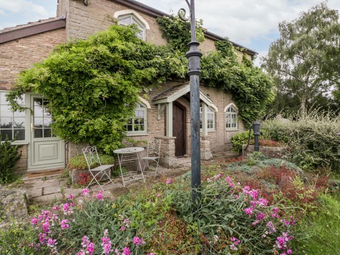 The Old Lodge is in Dymock near Newent, Gloucestershire, woodburning stove, off-road parking, 2beds.