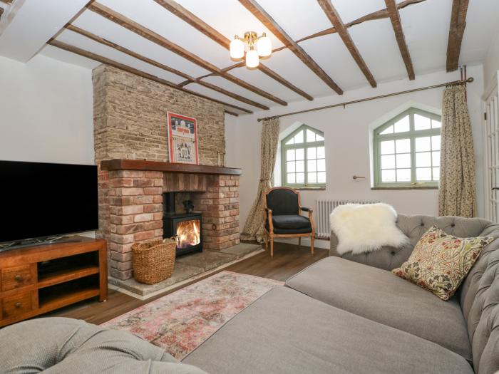 The Old Lodge is in Dymock near Newent, Gloucestershire, woodburning stove, off-road parking, 2beds.