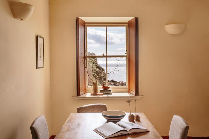 Cove Cottage is in Porthgwarra, Cornwall. Grade II listed home with pet-friendly policy. Near beach.