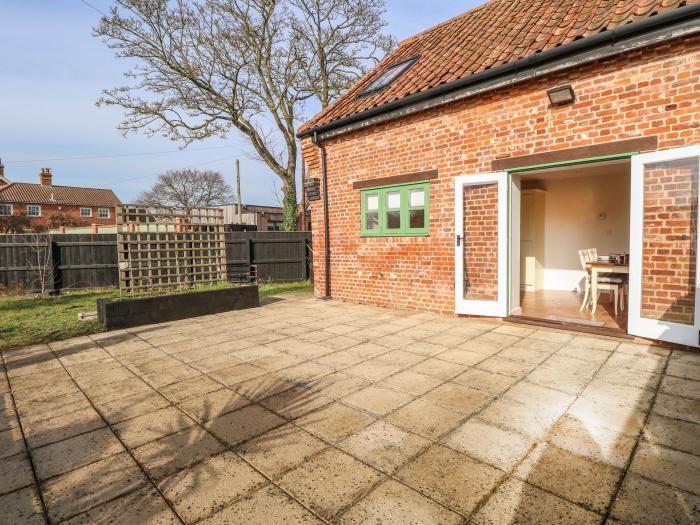 The Old Cartshed near Hopton-On-Sea in Suffolk. Enclosed garden and off-road parking. Stylish 2-bed.