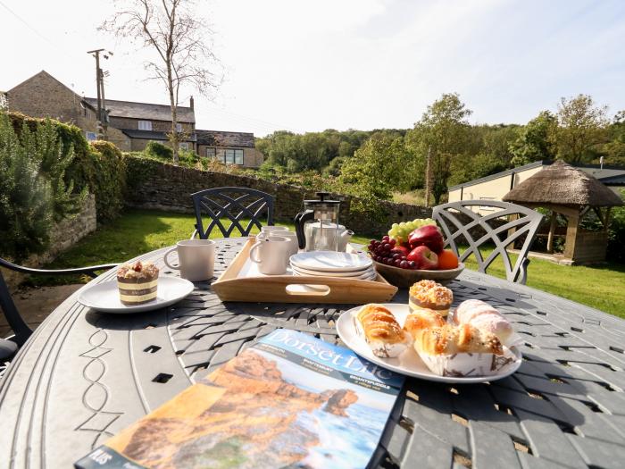 Dairy Cottage nr Abbotsbury, Dorset. Three-bedroom, thatched cottage with rural views. Pet-friendly.