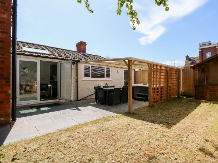 The Beach House in Mablethorpe in Lincolnshire. Close to amenities and beach. Garden with hot tub.