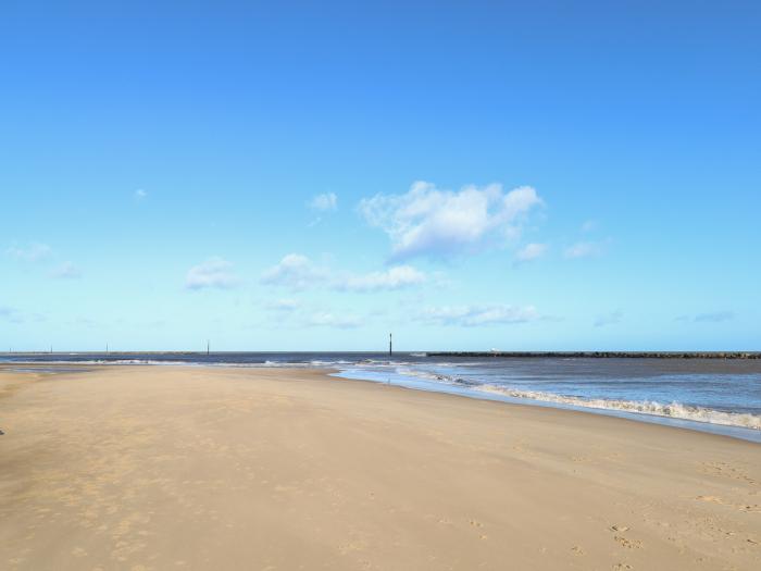 The Look Out, in Sea Palling, Norfolk. First-floor apartment with sea views. Near amenities & beach.