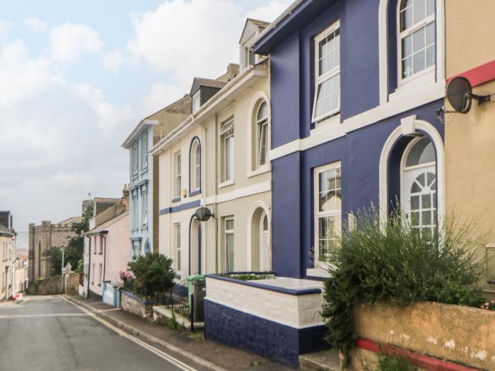 27 Exeter Street is in Teignmouth, Devon. Three-bedroom home near amenities and beach. Sea glimpses.