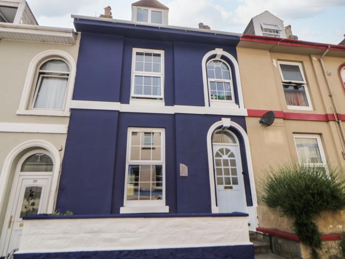 27 Exeter Street is in Teignmouth, Devon. Three-bedroom home near amenities and beach. Sea glimpses.