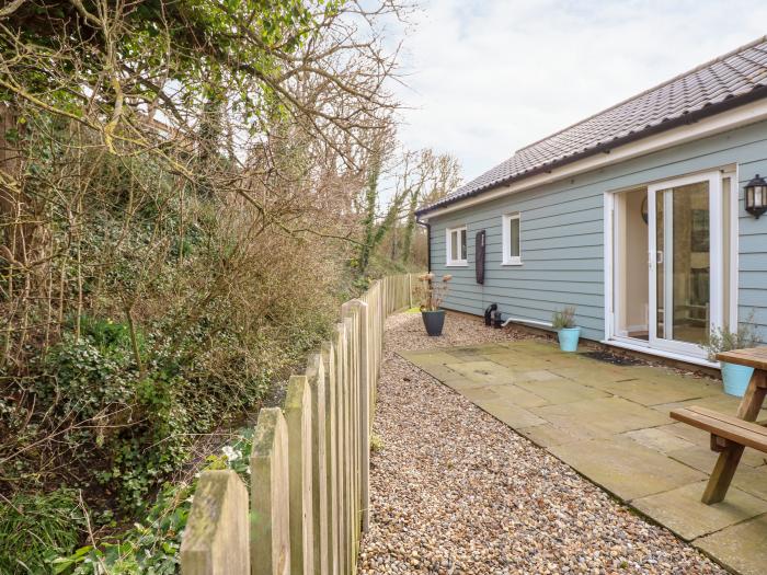 1 The Dell in Mundesley, Norfolk. Single-storey chalet inviting four guests and 2 well-behaved dogs.