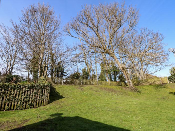 1 The Dell in Mundesley, Norfolk. Single-storey chalet inviting four guests and 2 well-behaved dogs.