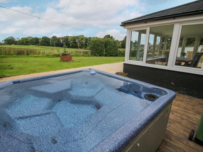 Shire Cottage is near Hanwood, in Shropshire. Four-bedroom home, with rural views and hot tub. Pets.