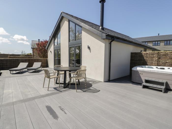 Garden House is in Llanfechell, Anglesey. Luxury, ground-floor home with hot tub and private garden.