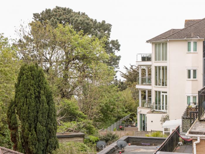 The Moorings, Bournemouth. First-floor apartment. Two bedrooms. Outlook over trees and pet-friendly