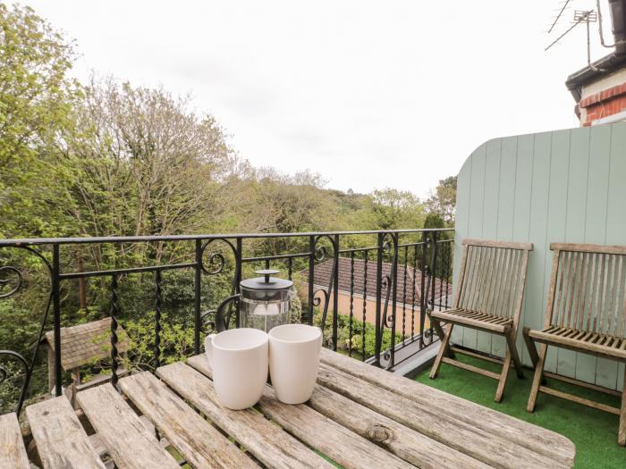 The Moorings, Bournemouth. First-floor apartment. Two bedrooms. Outlook over trees and pet-friendly