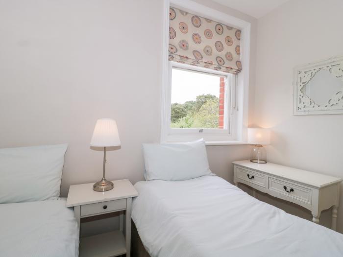 The Moorings, Bournemouth. First-floor apartment. Two bedrooms. Outlook over trees and pet-friendly