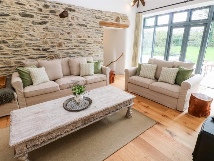 Wesley Barn, Cubert, Cornwall. Off-road parking. Garden. Hot tub. Pet-friendly. Ground-floor bedroom