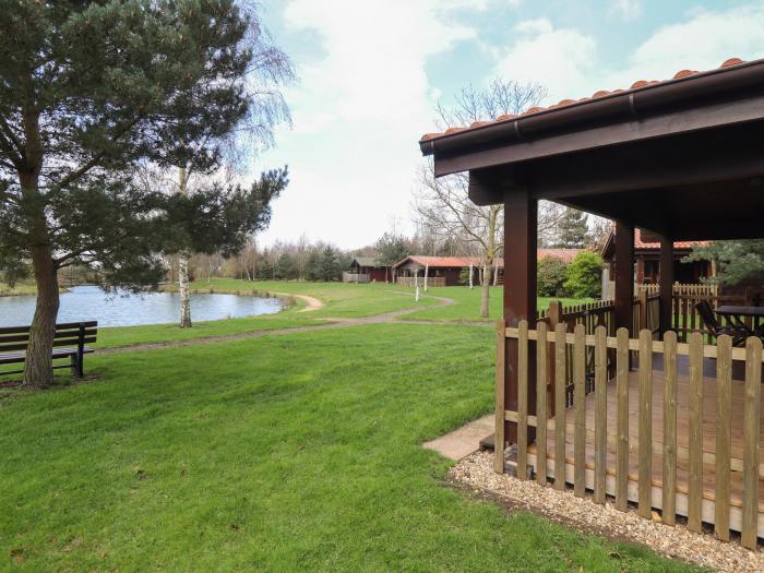 Tawny Lodge in Stainfield, Lincolnshire, sleeps four guests in two bedrooms. Pets & off-road parking