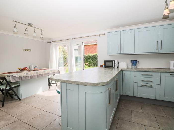 Alverstone Seaside near Gosport, Hampshire. Three-bedroom home set near amenities and coast. Garden.