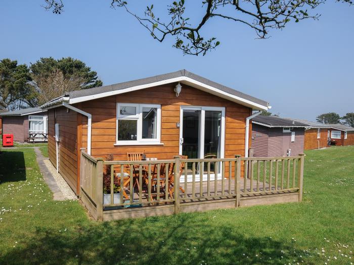 Little Trebah in Atlantic Bays Holiday Park in Cornwall. Decking with furniture. On-site facilities.