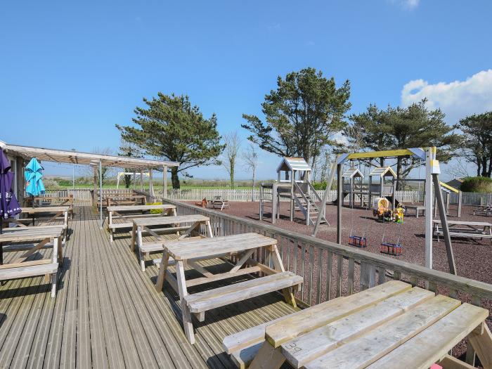 Little Trebah in Atlantic Bays Holiday Park in Cornwall. Decking with furniture. On-site facilities.