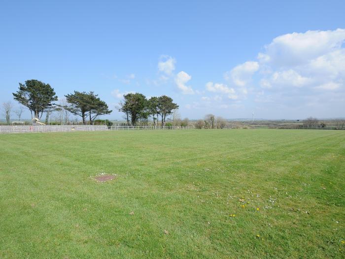 Little Trebah in Atlantic Bays Holiday Park in Cornwall. Decking with furniture. On-site facilities.