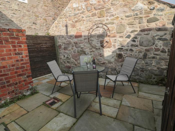 2 Cross View is in Norham, Northumberland. Mid-terrace cottage. Electric fire. Enclosed garden. WiFi