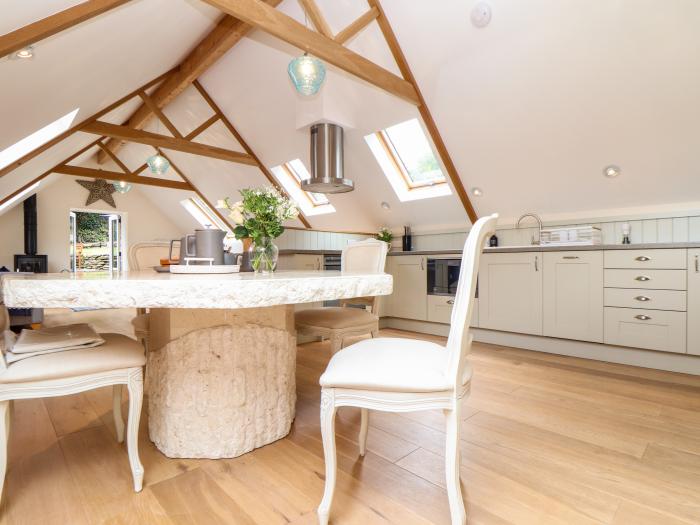 Potters Barn in Helston, Cornwall. Pet-friendly. Stone-built conversion. Reverse level. Two bedrooms