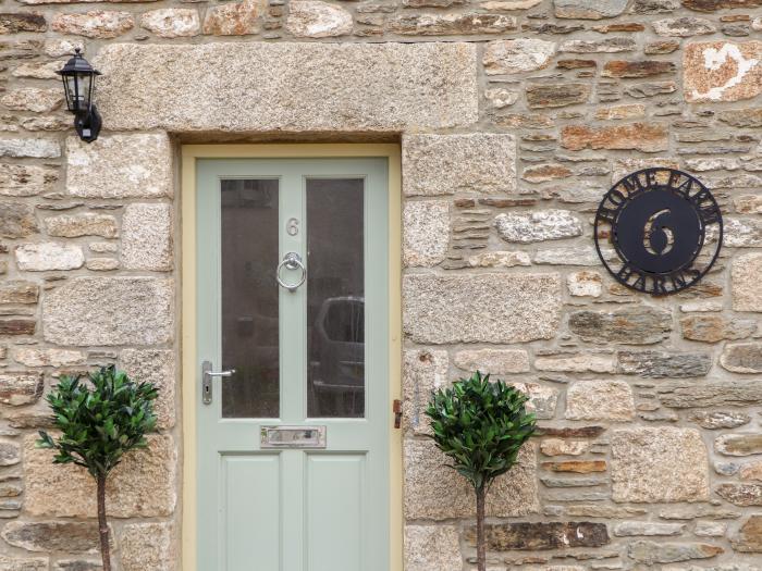 Potters Barn in Helston, Cornwall. Pet-friendly. Stone-built conversion. Reverse level. Two bedrooms