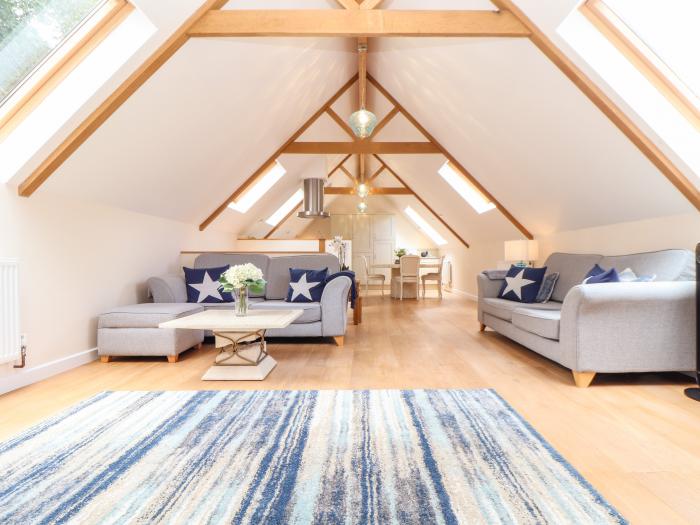 Potters Barn in Helston, Cornwall. Pet-friendly. Stone-built conversion. Reverse level. Two bedrooms