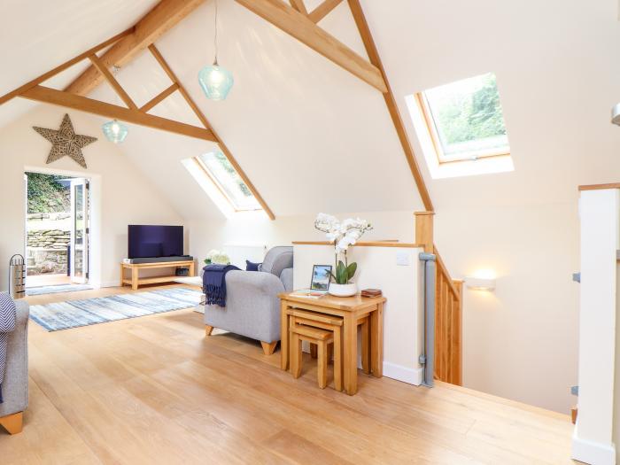 Potters Barn in Helston, Cornwall. Pet-friendly. Stone-built conversion. Reverse level. Two bedrooms