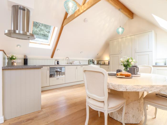 Potters Barn in Helston, Cornwall. Pet-friendly. Stone-built conversion. Reverse level. Two bedrooms