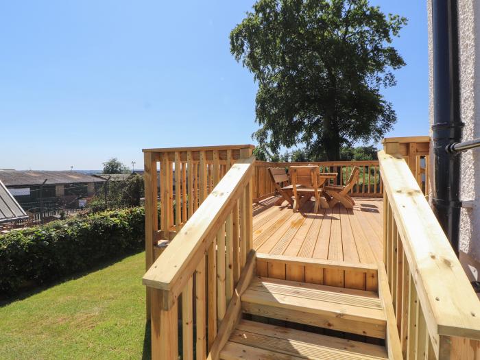 Rose Bank Cottage in Dalston, Cumbria. Three-bedroom home, with private sun terrace. Countryside.