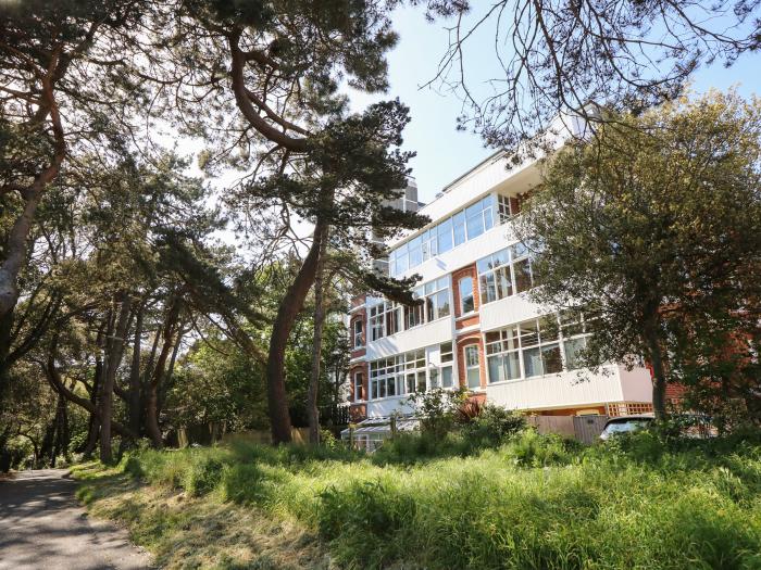 The Pines in Bournemouth in Dorset. First-floor apartment with woodland and sea views. Two bedrooms.