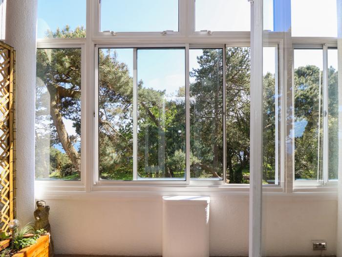 The Pines in Bournemouth in Dorset. First-floor apartment with woodland and sea views. Two bedrooms.