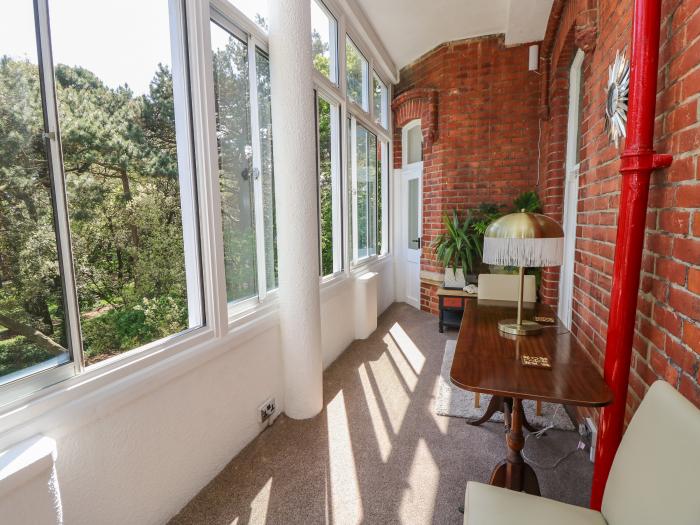 The Pines in Bournemouth in Dorset. First-floor apartment with woodland and sea views. Two bedrooms.