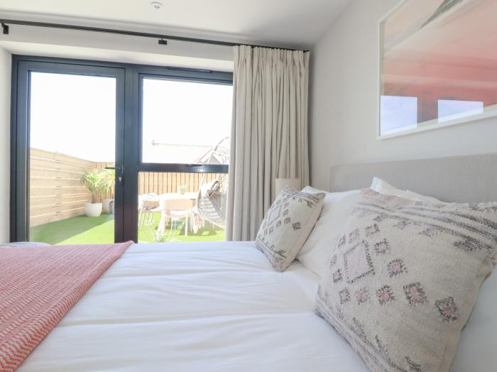 11 Ebbtide, Porth, Cornwall. Two-bedroom home, enjoying sea views. Pet-friendly, and near amenities.